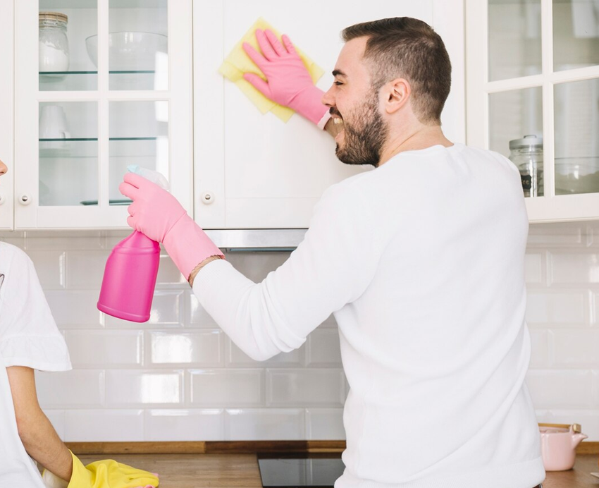 Cleaning professional with supplies